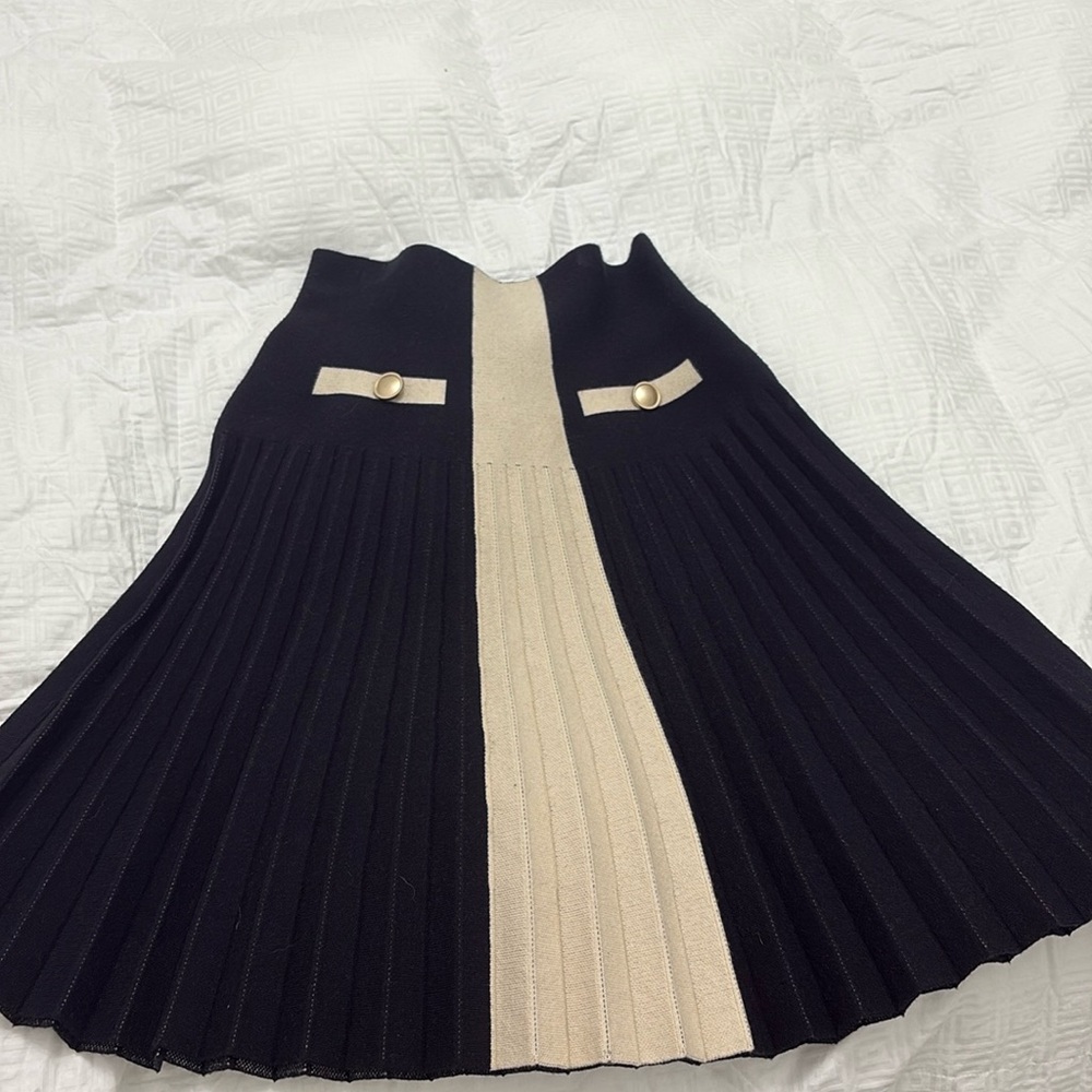 Black with beige pleated skirt